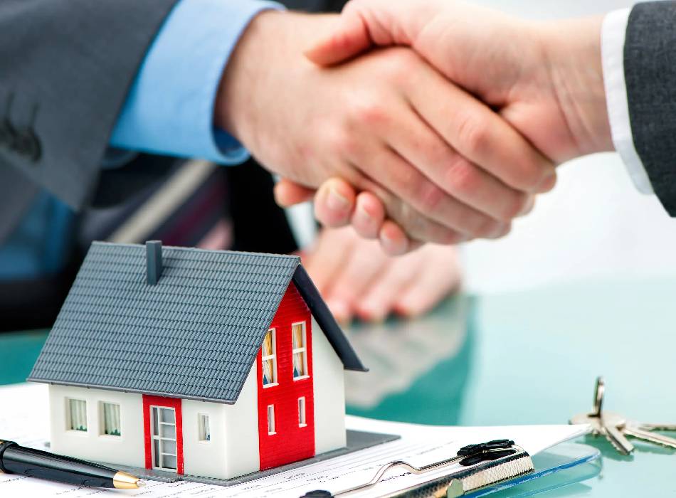 Family holding the keys to their new home